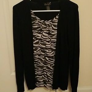 black sweater with a belt and purses